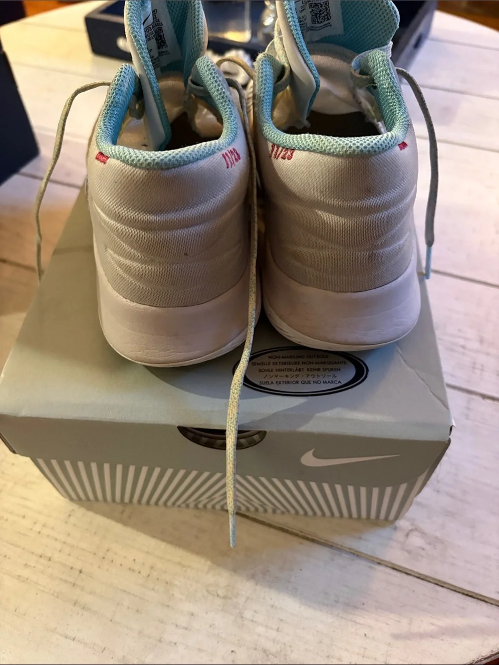 Nike Kids High-Top Sneakers in White with Teal Accents